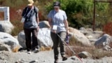 Taormina Lepore, foreground, who has low vision, walks with a white cane during the accessible field trip Sept. 26, 2024, in San Bernadino, Calif. (AP Photo/Ryan Sun)