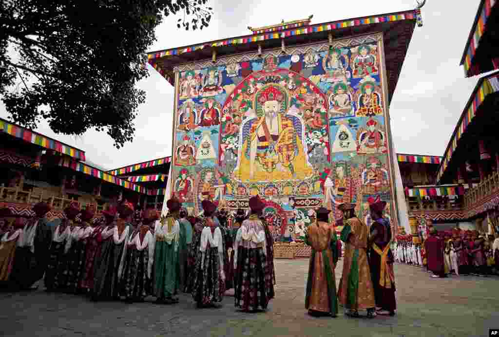 Bhuddist monks gather in a courtyard following the blessing of King Jigme Khesar Namgyel Wangchuck and Queen Jetsun Pema before they are married at the Punakha Dzong in Punakha. (AP)