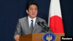 Japan's Prime Minister Shinzo Abe during a news conference in Doha, August 28, 2013 file photo. 