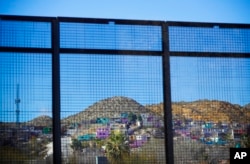Residential homes in the Mexican city of Ciudad Juarez are seen through border fencing during Acting Secretary of Defense Patrick Shanahan's tour of the U.S.-Mexico border in El Paso, Texas, Feb. 23, 2019.