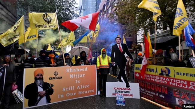 FILE - Demonstrators protest outside India's consulate, a week after Canada's Prime Minister Justin Trudeau raised the prospect of New Delhi's involvement in the murder of Sikh separatist leader Hardeep Singh Nijjar, in Vancouver, British Columbia, Canada, Sept. 25, 2023.