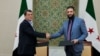 Syria's interim President Ahmed al-Sharaa, right, and commander of Syrian Kurdish-led forces Mazloum Abdi shake hands after reaching a ceasefire and military deal in Damascus, on March 10, 2025. (SANA/Handout via Reuters)