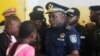 FILE - Former Kinshasa police chief, John Numbi, (C) walks into court,Jan. 27, 2011. Numbi was one of eight police officers accused of the death of a human rights activist in January 2010. 