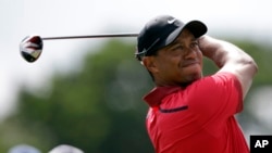 Tiger Woods hits from the third tee during the final round of the Cadillac Championship golf tournament, Mar. 9, 2014, in Doral, Florida. 