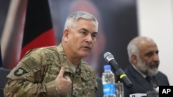 General John Campbell, left, commander of U.S. and NATO forces in Afghanistan, and Afghan acting Defense Minister Masoom Stanekzai hold a press conference at the Afghan Defense ministry in Kabul, Feb. 7, 2016. 