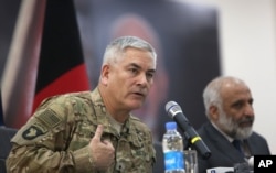 General John Campbell, left, commander of U.S. and NATO forces in Afghanistan, and Afghan acting Defense Minister Masoom Stanekzai hold a press conference at the Afghan Defence ministry in Kabul, Feb. 7, 2016.