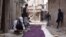 Free Syrian Army fighters prepare curtains to be erected as cover from snipers loyal to Syria's President Bashar al-Assad, Babeela area of suburban Damascus, March 30, 2013.