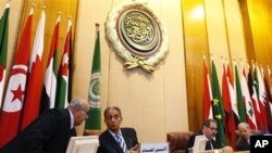 Arab League Secretary General Amr Moussa, second left, and Iraqi Foreign Minister Hoshyar Zebari, second right, head an Arab League foreign ministers meeting at Arab League headquarters in Cairo, Egypt, March 2, 2011