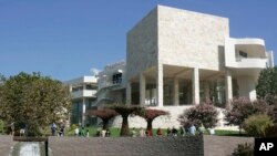 FILE - Visitors walk in the gardens at the J. Paul Getty Museum in Los Angeles,Oct. 9, 2005.