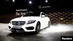 The new Mercedes-Benz 2015 C-Class is displayed during a private preview for media at the Westin Book Cadillac Hotel in Detroit, Michigan, Jan. 12, 2014, on the eve of the 2014 North American International Auto Show. 