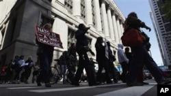 Dozens take part in a variety of protests leading up to this weekend's NATO summit in Chicago, May 16, 2012.