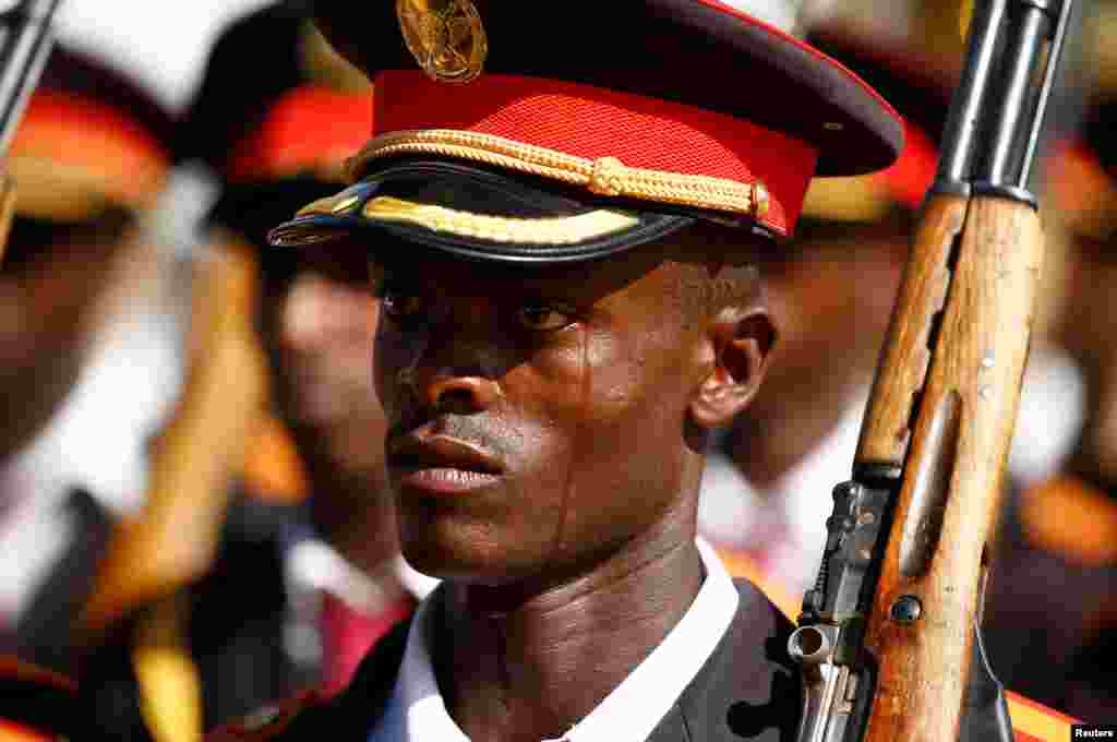 A member of Ethiopia's military reacts as he stands in a parade during the 121st celebration of the battle of Adwa - between the Ethiopian Empire and the Kingdom of Italy - near the town of Adwa, Ethiopia.
