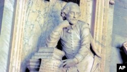 FILE - Photo provided by VisitBritain shows a monument to William Shakespeare at Westminster Abbey in London.