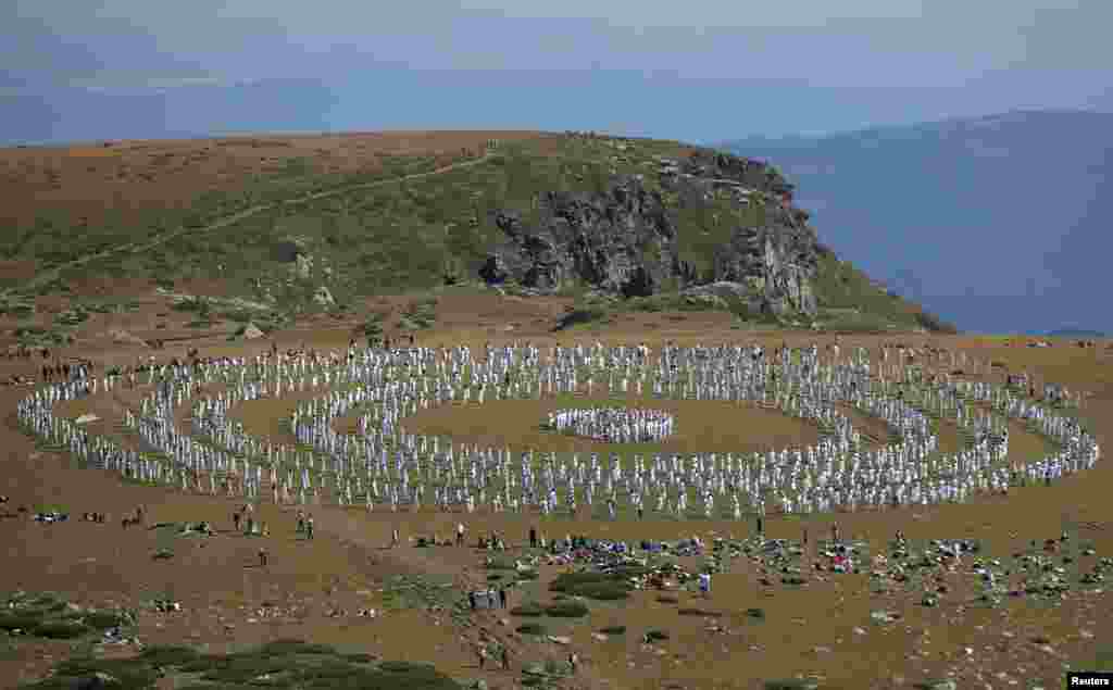 Followers of the Universal White Brotherhood, an esoteric society that combines Christianity and Indian mysticism set up by Bulgarian Peter Deunov in the 1920s, perform a dance-like ritual called &quot;paneurhythmy&quot; in Rila Mountain, Bulgaria, Aug.19, 2019.