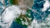This satellite image provided by the National Oceanic and Atmospheric Administration shows Hurricane Olaf on the Pacific coast of Mexico approaching the Los Cabos resort region, early on Sept. 9, 2021.