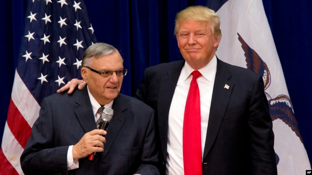 FILE - Republican presidential candidate Donald Trump is joined by Maricopa County, Ariz., Sheriff Joe Arpaio at a campaign event in Marshalltown, Iowa, Jan. 26, 2016.