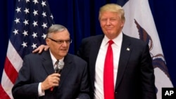 FILE - Republican presidential candidate Donald Trump is joined by Maricopa County, Ariz., Sheriff Joe Arpaio at a campaign event in Marshalltown, Iowa, Jan. 26, 2016.