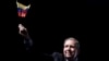 Venezuela's opposition leader Edmundo Gonzalez waves a Venezuelan flag during a meeting with supporters in Panama City, Jan. 8, 2025. 