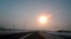 In this frame grab made from a video done with a dashboard camera, on a highway from Kostanai, Kazakhstan, to Chelyabinsk region, Russia, provided by Nasha Gazeta newspaper, February 15, 2013 a meteorite contrail is seen. A meteor streaked across the sky 