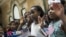 Children take the Oath of Allegiance as they become U.S. citizens during a citizenship ceremony at The Bronx Zoo, May 5, 2017, in The Bronx borough of New York City.