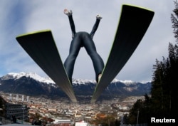 FILE - Austria's Gregor Schlierenzauer takes off from the ski jump during the first practice session of the third jumping of the four-hills tournament in Innsbruck, Jan. 3, 2014.
