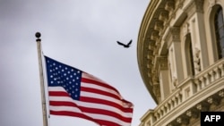 An American flag flies at the U.S. Capitol in Washington, Oct. 30, 2019.