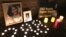 FILE - Flowers and photos at a vigil for Nazanin Zaghary-Ratcliffe, a British-Iranian woman detained in Iran, are seen in this Jan. 16, 2017 photo.