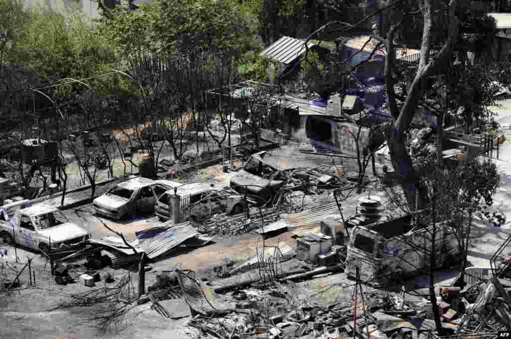 The burnt neighborhood of Pinchinades in Vitrolles, southern France, following a fire which has devastated some 3,300 hectares the night before