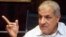 FILE - Egypt's outgoing Housing Minister Ibrahim Mahlab -- named as the country's new prime minister -- talks during an interview with the media in Cairo, September 2012.