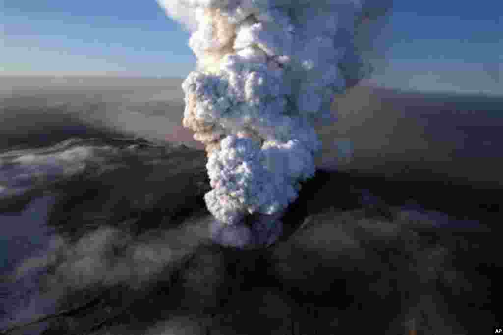 April 17: This aerial image shows the crater spewing ash and plumes of grit at the summit of the volcano in southern Iceland's Eyjafjallajokull glacier. A volcanic ash plume forced extended no-fly restrictions over much of Europe, as Icelandic scientists 