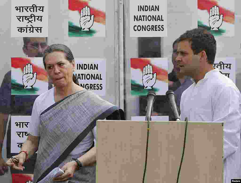 Congress party chief Sonia Gandhi and her son and vice president of Congress, Rahul Gandhi, leave after addressing a news conference.&nbsp;India&#39;s Nehru-Gandhi dynasty, the towering force of Indian politics for much of the last century, faces a fight for its survival, in New Delhi, May 16, 2014.