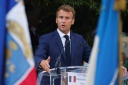 French President Emmanuel Macron speaks in Bormes-les-Mimosas, France, August 17, 2021.