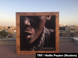 A photograph of a former child beggar displayed at the "Look at me" exhibition, Dakar, Senegal, May 3, 2018.
