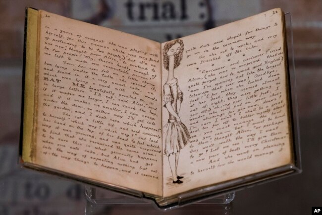 The illustrated original manuscript for Lewis Carroll’s Alice’s Adventures in Wonderland is displayed at the Rosenbach of the Free Library of Philadelphia Tuesday, Oct. 13, 2015, in Philadelphia. (AP Photo/Matt Rourke)