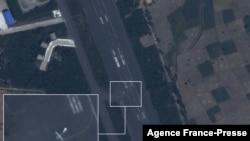 This handout satellite image taken on December 2, 2021 by Planet Labs PBC shows what Dutch peace organization PAX says is a drone with the measurement that fits the Iranian Mohajer-6 on the tarmac at Harar Meda air base in Bishoftu. (Planet Labs PBC / AFP)