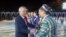 Uzbekistan's President Islam Karimov (L) greets artists during an Independence Day celebration in Tashkent August 31, 2012. Uzbekistan is marking the 21st anniversary of independence. REUTERS/Shamil Zhumatov (UZBEKISTAN - Tags: POLITICS ANNIVERSARY)