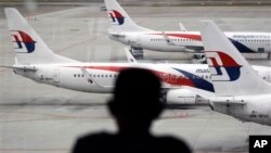 Fleet of Malaysia Airline planes on the tarmac of the Kuala Lumpur International Airport, in Malaysia, Jan. 29, 2015.