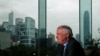 FILE - Former Hong Kong Governor Chris Patten sits in a hotel restaurant overlooking Hong Kong's financial Central district during an interview by Reuters in Hong Kong, March 15, 2012. 