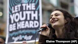 In this Monday, Oct. 29, 2018 file photo, Jamie Margolin, a high school student, speaks during a rally by youth activists and others in Seattle in support of a high-profile climate change lawsuit in federal court in Eugene, Oregon. (AP Photo/Elaine Thompson)