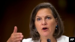 FILE - In this July 9, 2014 photo, Assistant Secretary of State Victoria Nuland testifies on Capitol Hill in Washington.