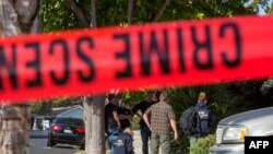 FBI agents collect evidence at the home of suspected nightclub shooter Ian David Long in Thousand Oaks, Calif., Nov. 8, 2018.
