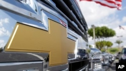 FILE - The Chevrolet logo is displayed at Miami Lakes AutoMall in Miami Lakes, Fla., Oct. 1, 2014. 