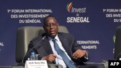 FILE - Senegalese President Macky Sall looks on during the opening of the 1st Senegal International Investment Forum at the Abdou Diouf International Conference Centre in Diamniadio on July 6, 2023. 