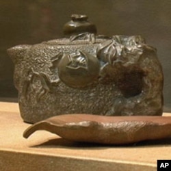 Homei Iseyama, an internee at Topaz, Utah, carved a number of teapots and other objects from slate found at the camp