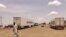 FILE - Trucks carrying foreign humanitarian aid pass by Gedaref on the main road linkin the Sudanse capital Khartoum with Port Sudan on July 10, 2023.