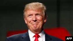 US Republican Presidential nominee Donald Trump addresses supporters at Macomb Community College on Oct. 31, 2016 in Warren, Michigan.