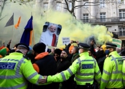 British Sikhs gather to protest against India's new farming legislation, outside the High Commission of India in London, Britain, Dec. 6, 2020.