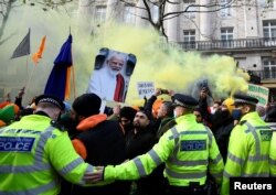 British Sikhs gather to protest against India's new farming legislation, outside the High Commission of India in London, Britain, Dec. 6, 2020.