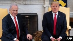 U.S. President Donald Trump and Israeli Prime Minister Benjamin Netanyahu hold a meeting in the Oval Office at the White House in Washington, March 25, 2019.