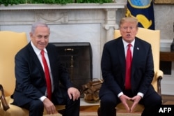 U.S. President Donald Trump and Israeli Prime Minister Benjamin Netanyahu hold a meeting in the Oval Office at the White House in Washington, March 25, 2019.